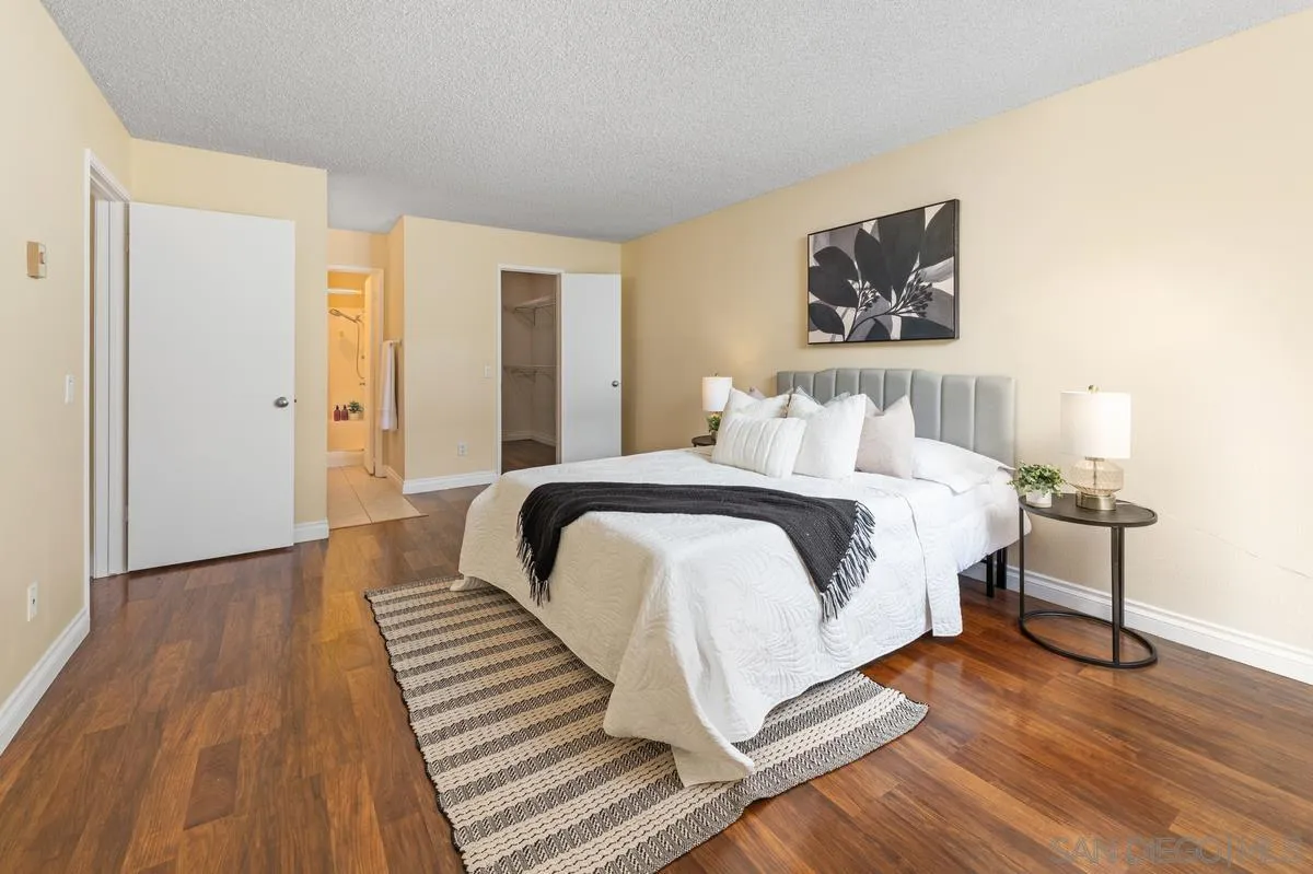 2332 Hosp Way, Unit 207 Carlsbad, CA 92008 - Photo 13 of 31 a bedroom with a bed and a painting on the wall