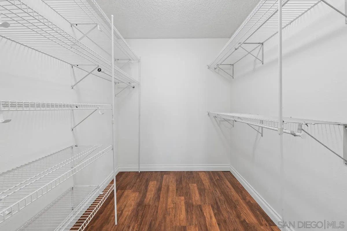 2332 Hosp Way, Unit 207 Carlsbad, CA 92008 - Photo 14 of 31 a view of a room with racks on the wall