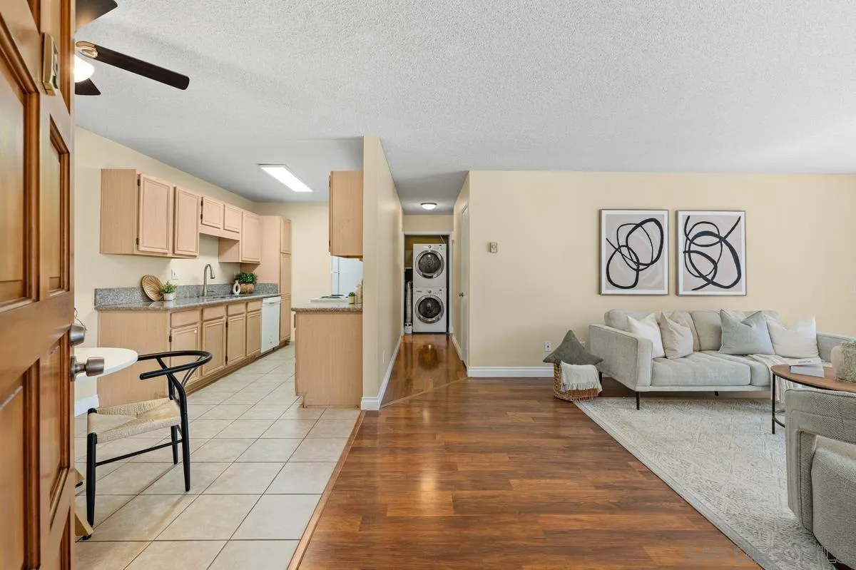 2332 Hosp Way, Unit 207 Carlsbad, CA 92008 - Photo 2 of 31 a living room with furniture and a table