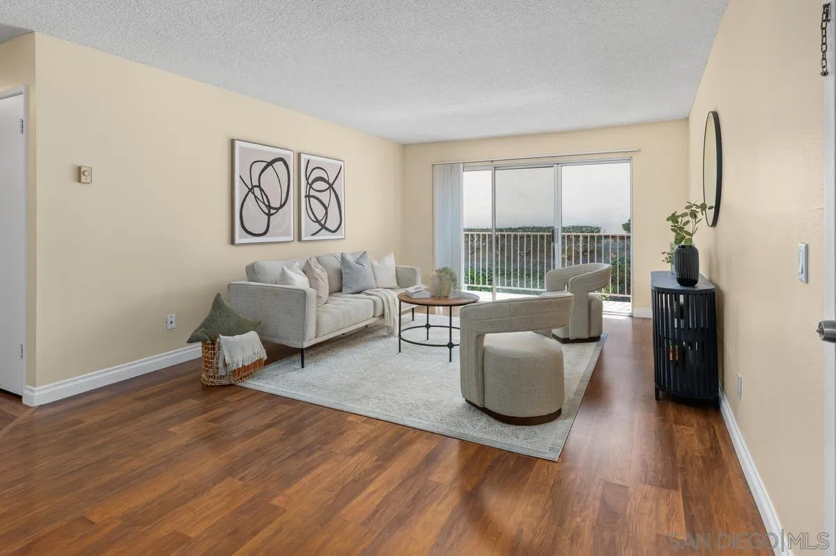 2332 Hosp Way, Unit 207 Carlsbad, CA 92008 - Photo 3 of 31 a living room with furniture and a large window