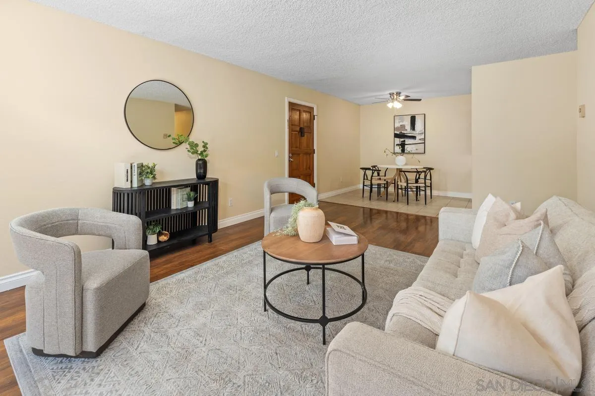 2332 Hosp Way, Unit 207 Carlsbad, CA 92008 - Photo 4 of 31 a living room with furniture a rug and a window