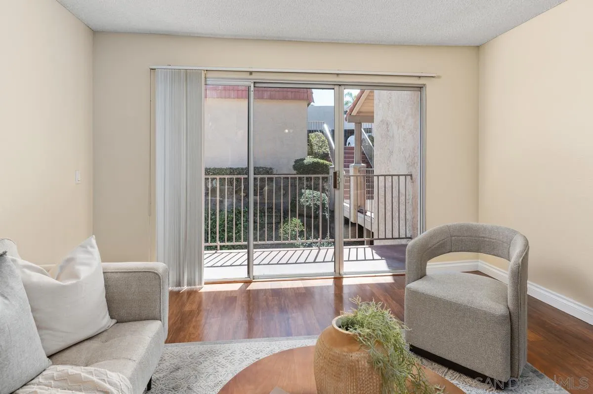 2332 Hosp Way, Unit 207 Carlsbad, CA 92008 - Photo 5 of 31 a living room with furniture and a large window
