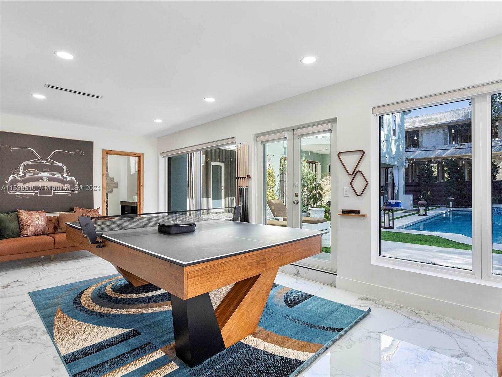 4431 Alton Road, Unit 1 Miami Beach, FL 33140 - Photo 13 of 60 a room with furniture and a window