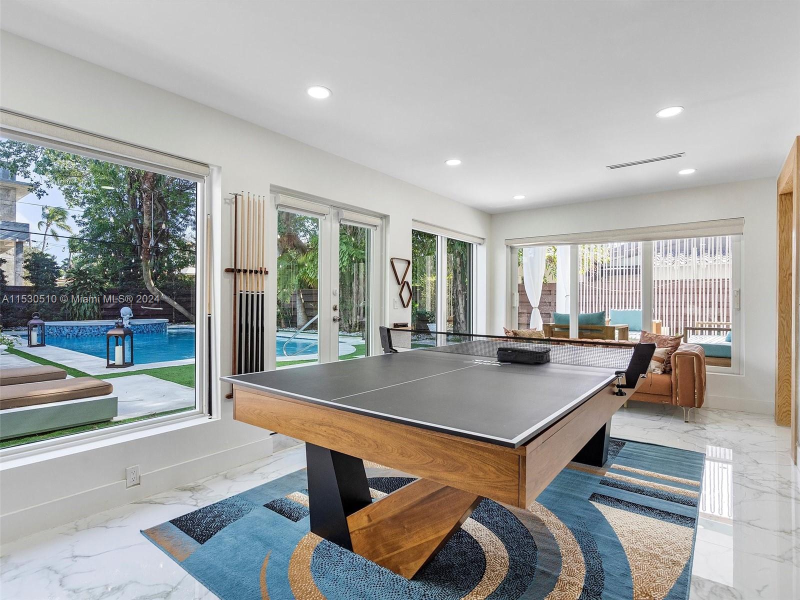 4431 Alton Road, Unit 1 Miami Beach, FL 33140 - Photo 14 of 60 a room with furniture pool table and glass windows