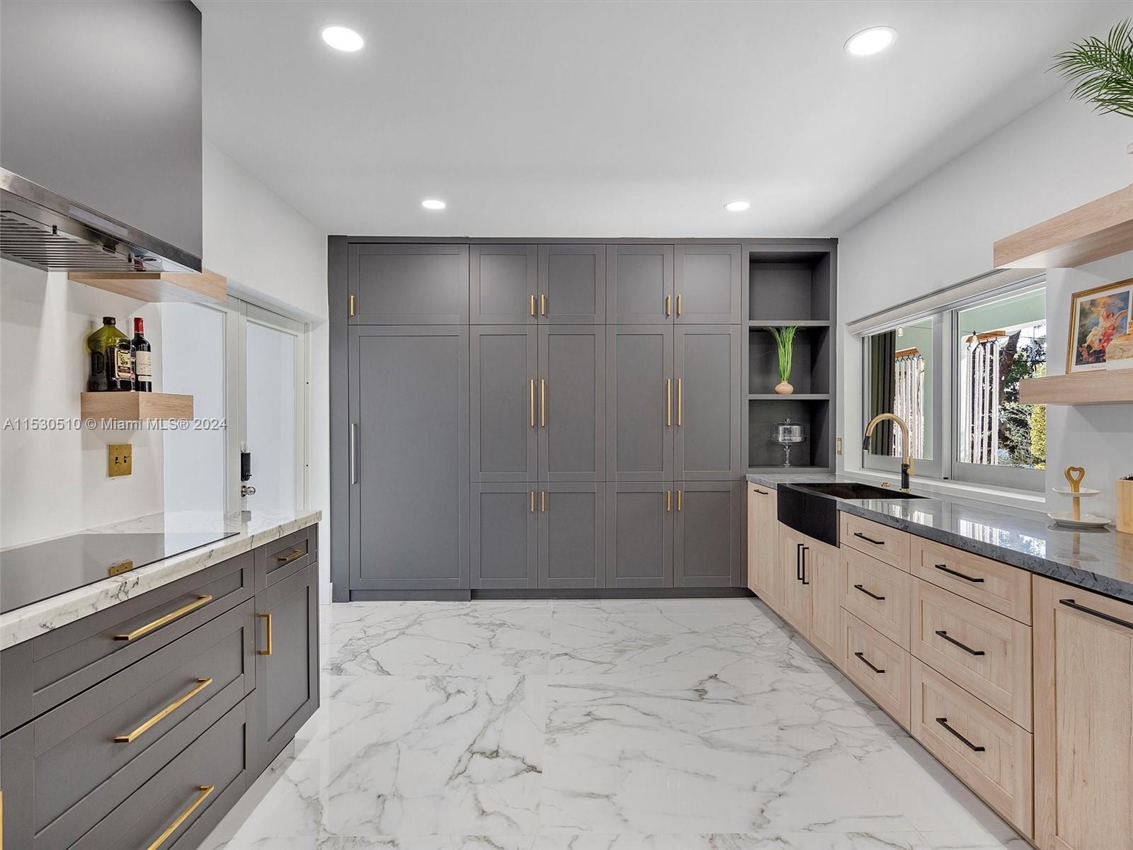 4431 Alton Road, Unit 1 Miami Beach, FL 33140 - Photo 20 of 60 a large bathroom with a granite countertop sink a mirror and a