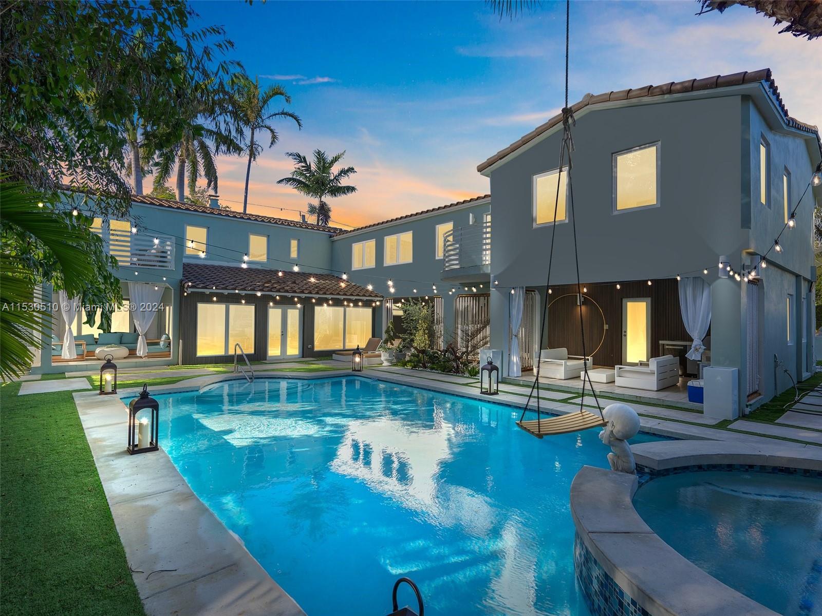 4431 Alton Road, Unit 1 Miami Beach, FL 33140 - Photo 2 of 60 a view of a house with swimming pool and sitting area