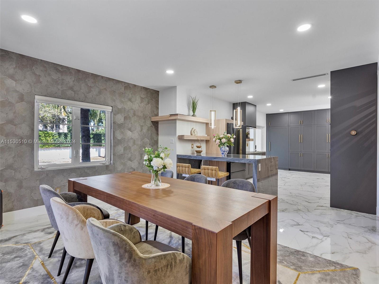 4431 Alton Road, Unit 1 Miami Beach, FL 33140 - Photo 23 of 60 a view of a dining room with furniture