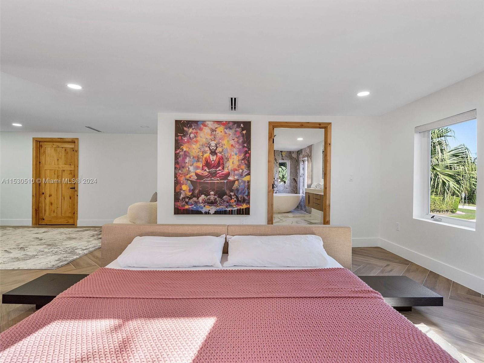 4431 Alton Road, Unit 1 Miami Beach, FL 33140 - Photo 31 of 60 a bedroom with a bed and a couch