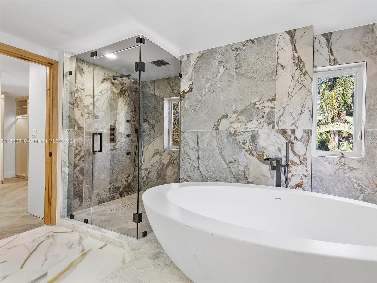 4431 Alton Road, Unit 1 Miami Beach, FL 33140 - Photo 34 of 60 a bathroom with a bathtub and shower