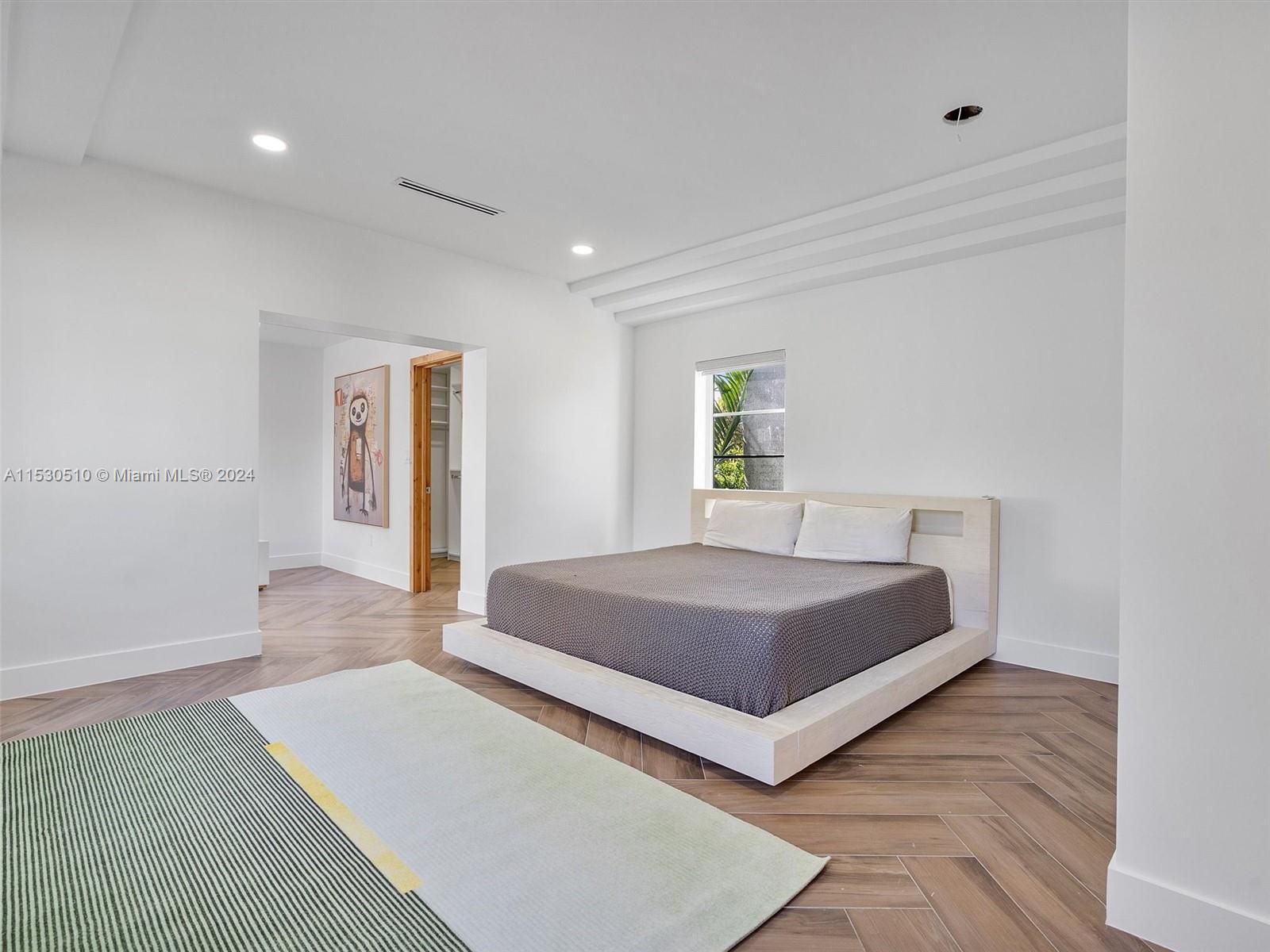 4431 Alton Road, Unit 1 Miami Beach, FL 33140 - Photo 38 of 60 a bedroom with a bed and window