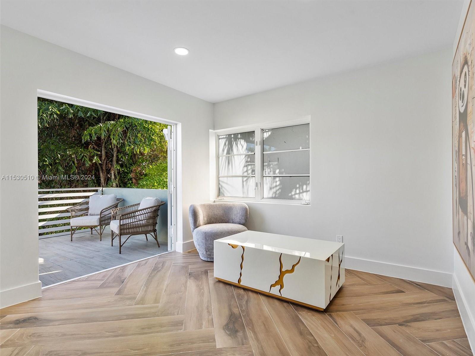4431 Alton Road, Unit 1 Miami Beach, FL 33140 - Photo 40 of 60 a living room with furniture and a window