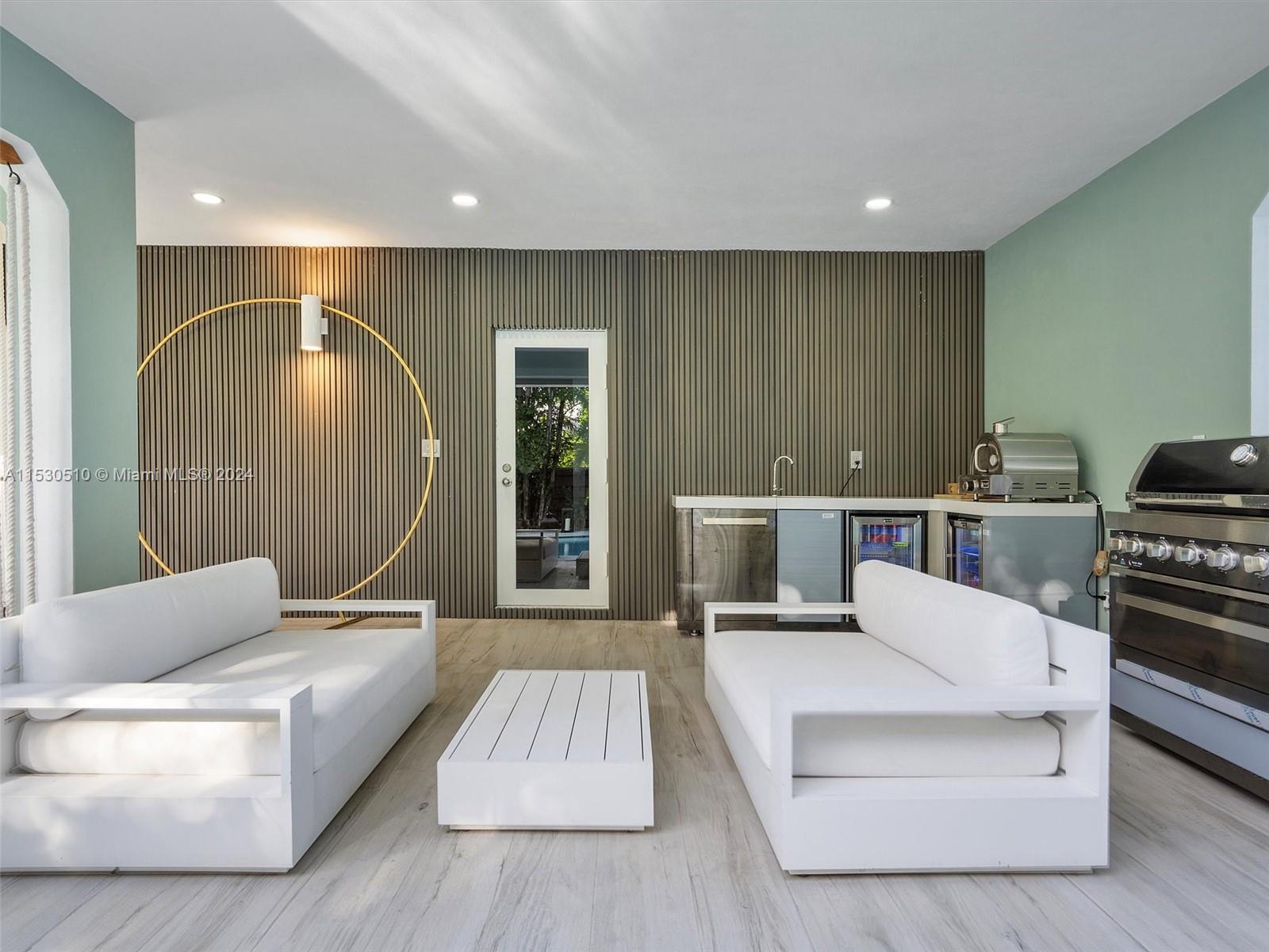 4431 Alton Road, Unit 1 Miami Beach, FL 33140 - Photo 52 of 60 a living room with furniture and a large window