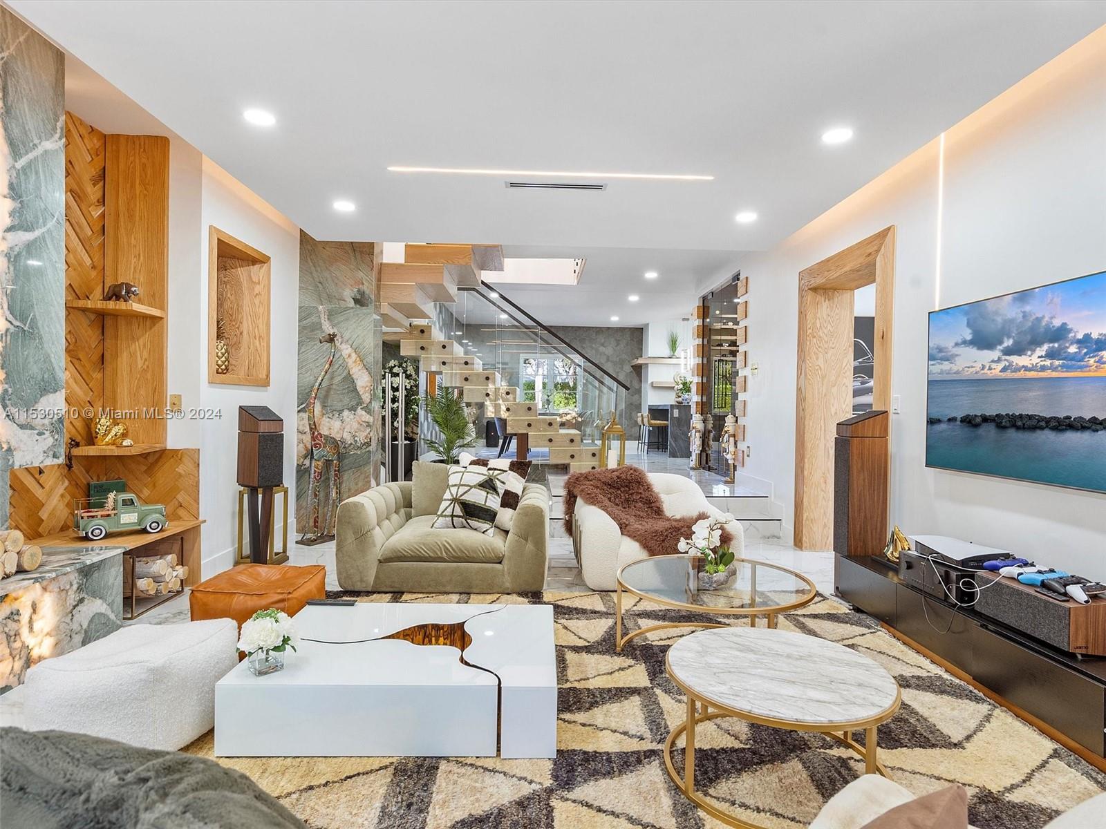 4431 Alton Road, Unit 1 Miami Beach, FL 33140 - Photo 9 of 60 a living room with furniture and a flat screen tv