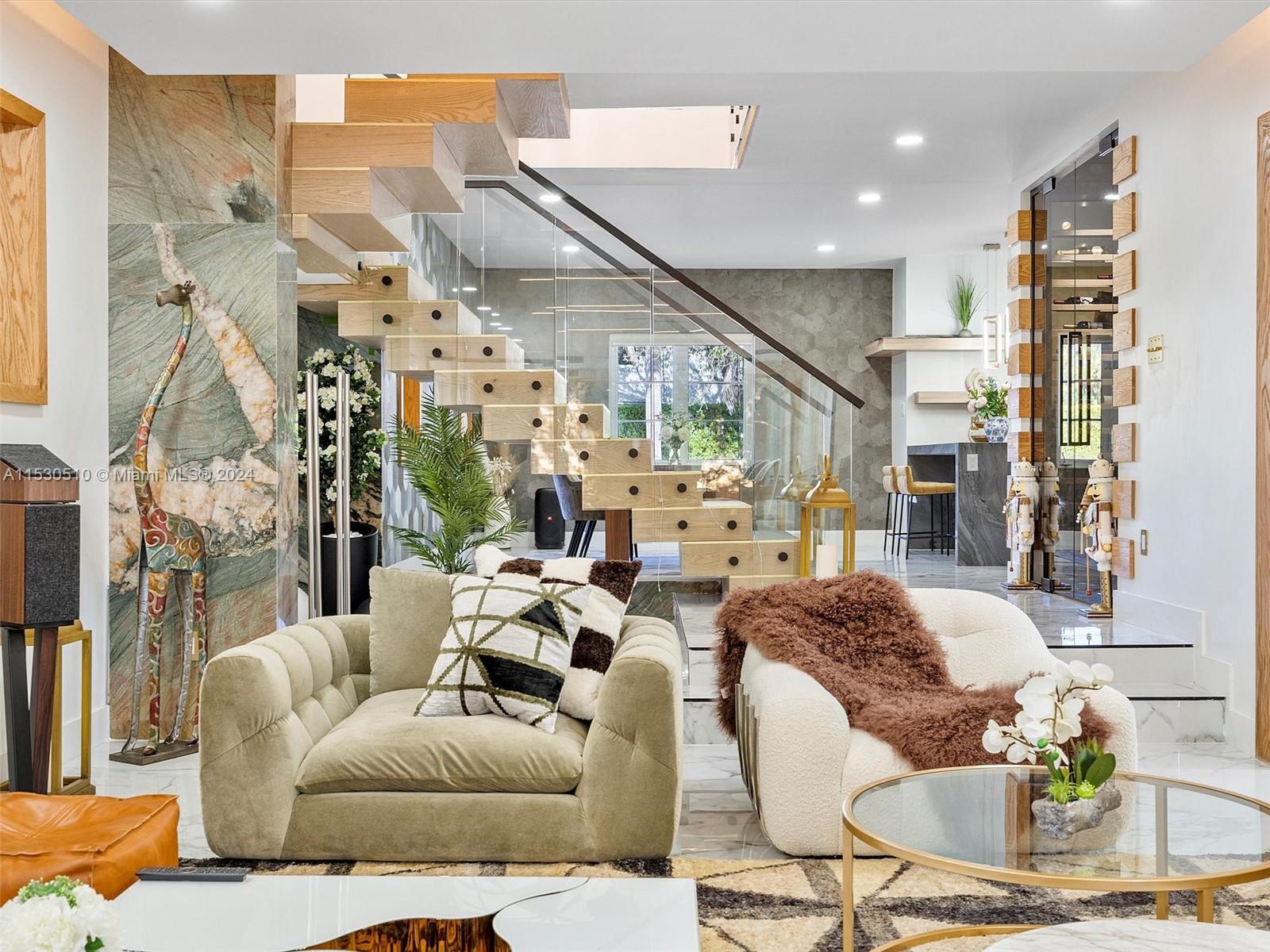 4431 Alton Road, Unit 1 Miami Beach, FL 33140 - Photo 10 of 60 a living room with furniture and a chandelier