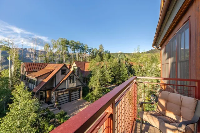 a view of balcony with furniture