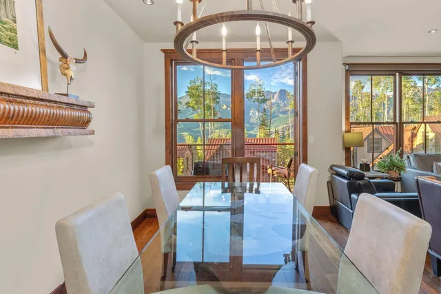a view of a dining room with furniture window and outside view