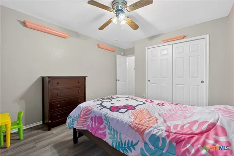 a bedroom with a bed and a dresser