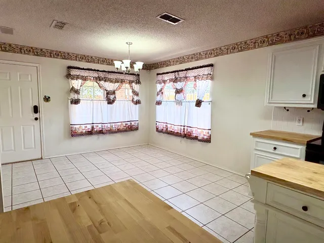 a view of a garage with racks on the wall
