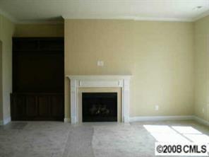 2009 Fallondale Road Waxhaw, NC 28173 - Photo 4 of 8 a view of an empty room with a fireplace