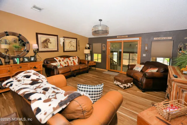 a kitchen with stainless steel appliances granite countertop a stove top oven and cabinets