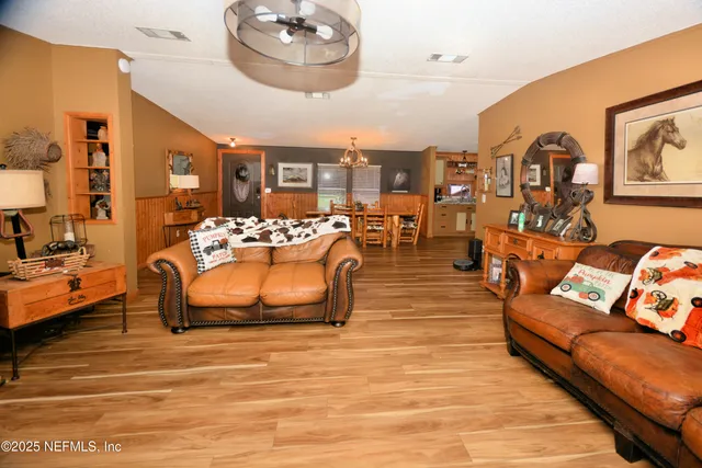 a large kitchen with lots of counter space and stainless steel appliances