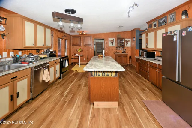 a bedroom with furniture and a rug