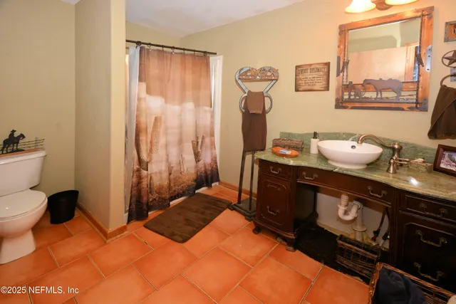 a view of walk in closet with clothes