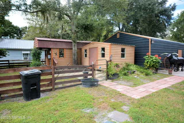 a view of house with outdoor space and sitting area