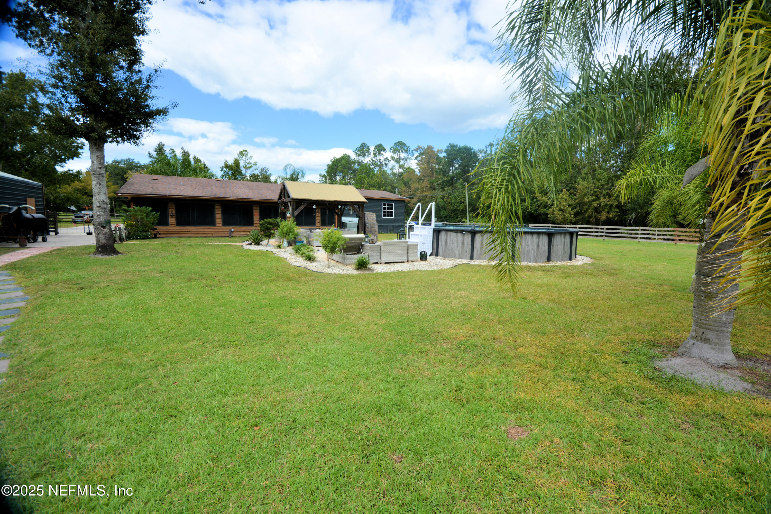 2241 Marlee Road South Jacksonville, FL 32259 - Photo 42 of 61 a view of a house with backyard porch and sitting area