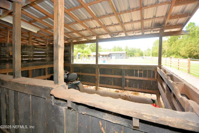 a view of swimming pool with a garden and seating area