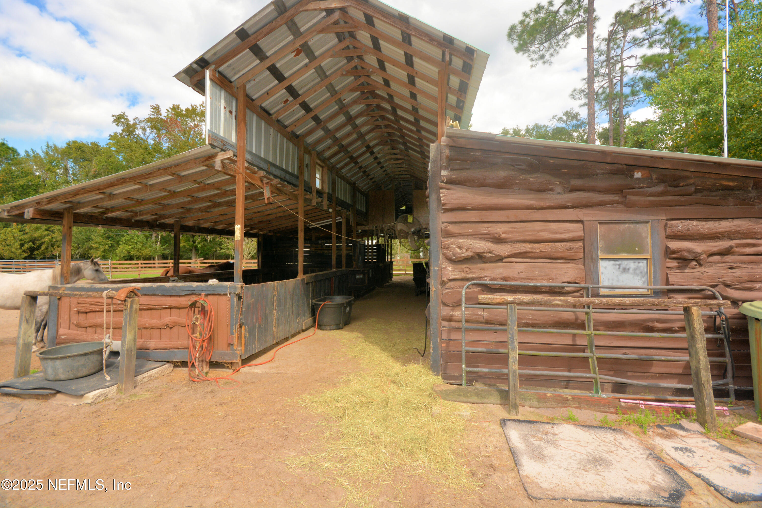 2241 Marlee Road South Jacksonville, FL 32259 - Photo 55 of 61 a view of a patio with table and chairs with wooden floor and fence