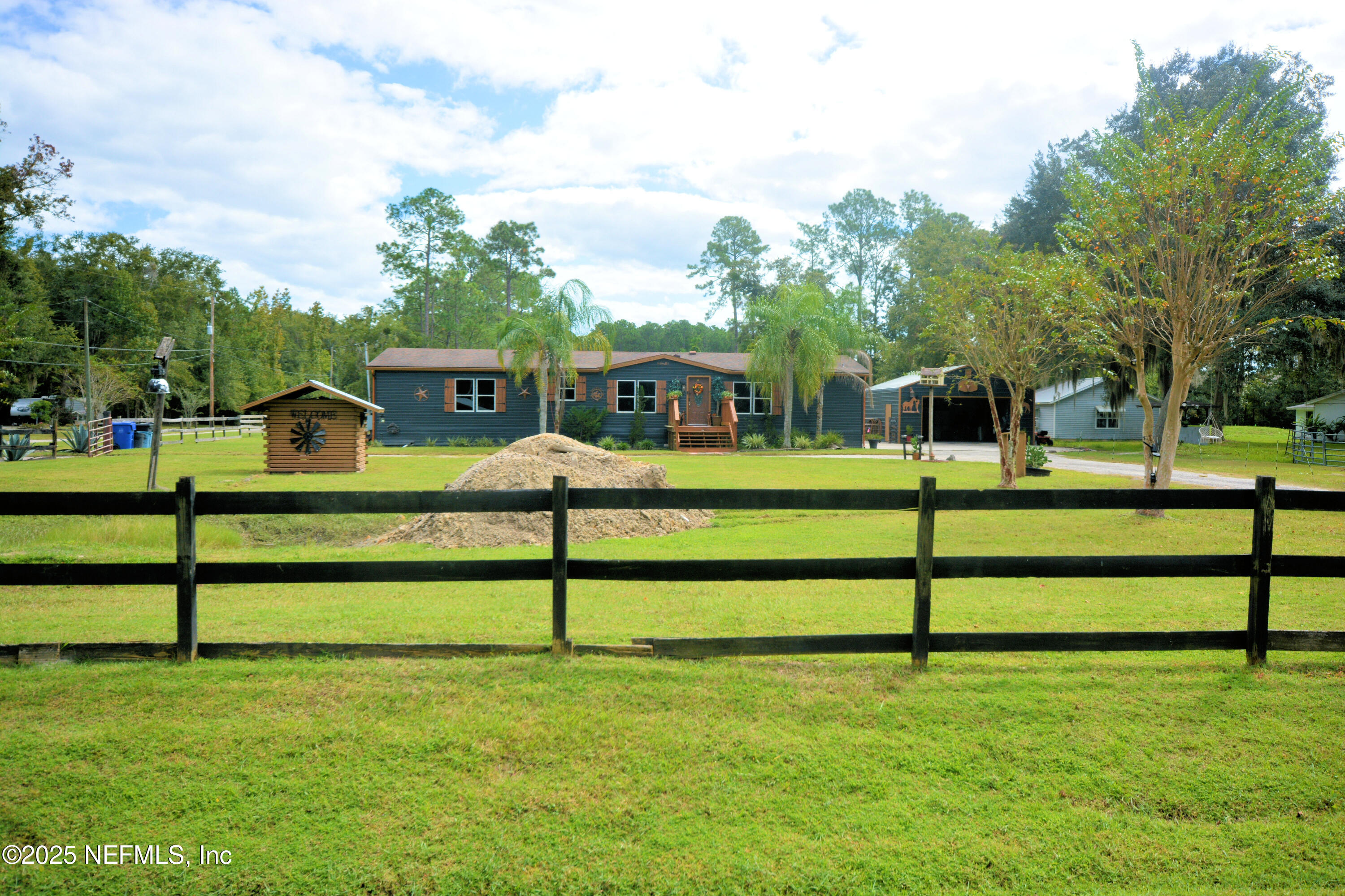 2241 Marlee Road South Jacksonville, FL 32259 - Photo 6 of 61 a view of a bench in front of a yard