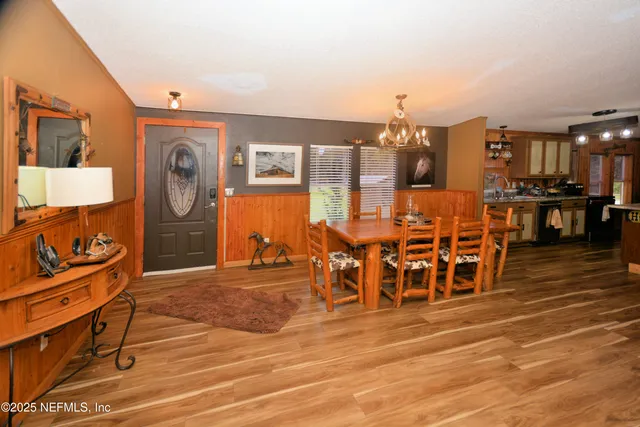 a bedroom with furniture and wooden floor
