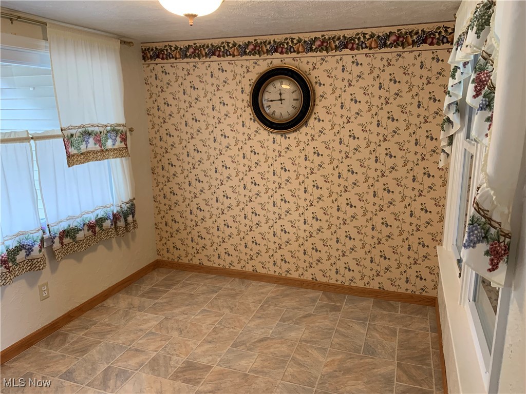 16879 Ridgeview Drive East Liverpool, OH 43920 - Photo 12 of 22 Empty room featuring a textured ceiling