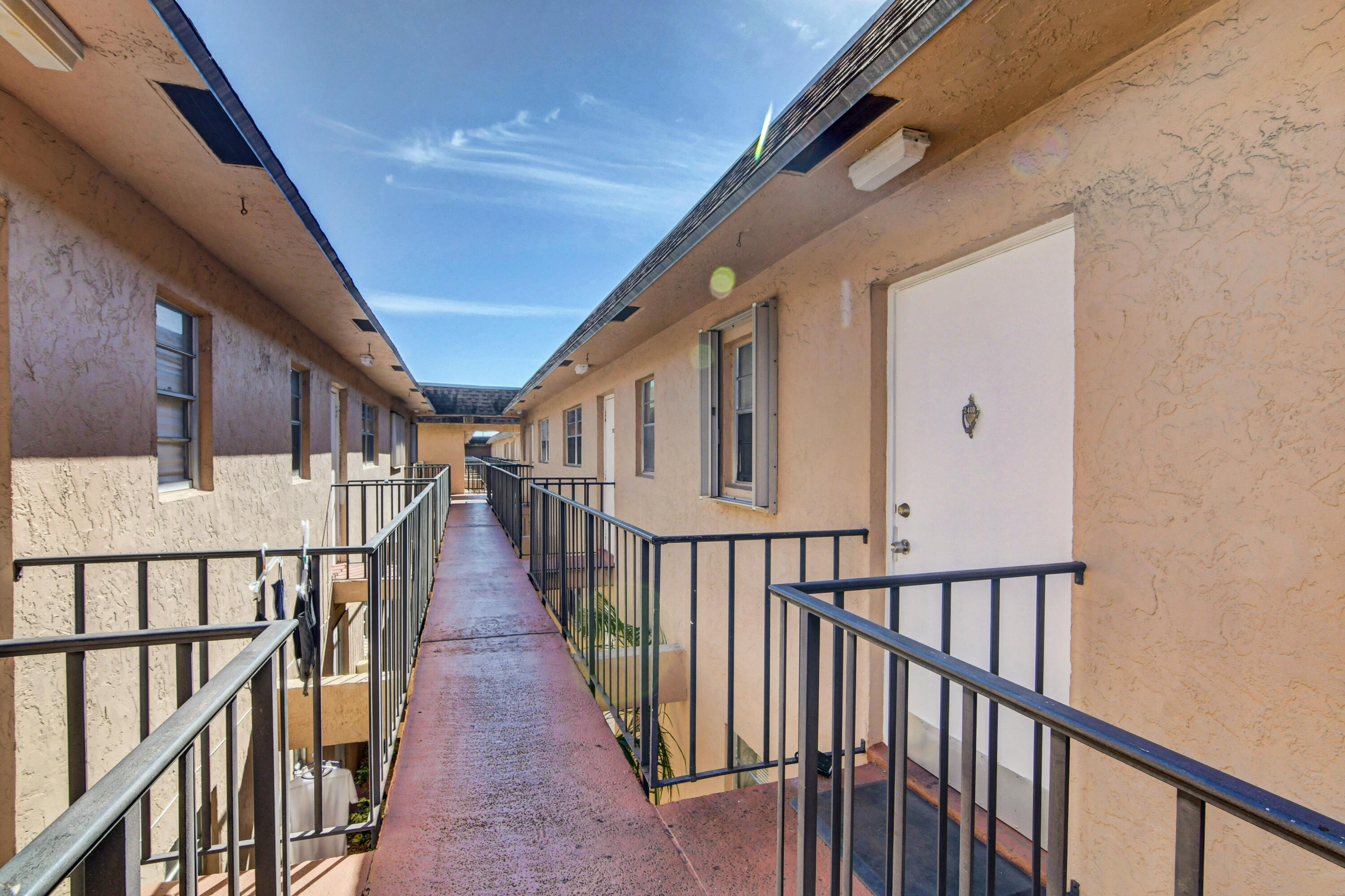 600 Southwest 2nd Avenue, Unit 240 Boca Raton, FL 33432 - Photo 32 of 42 Breezeway to the Front Door