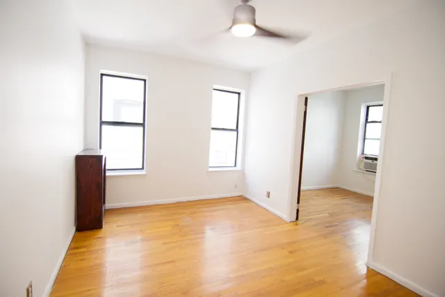 a view of an empty room with a window