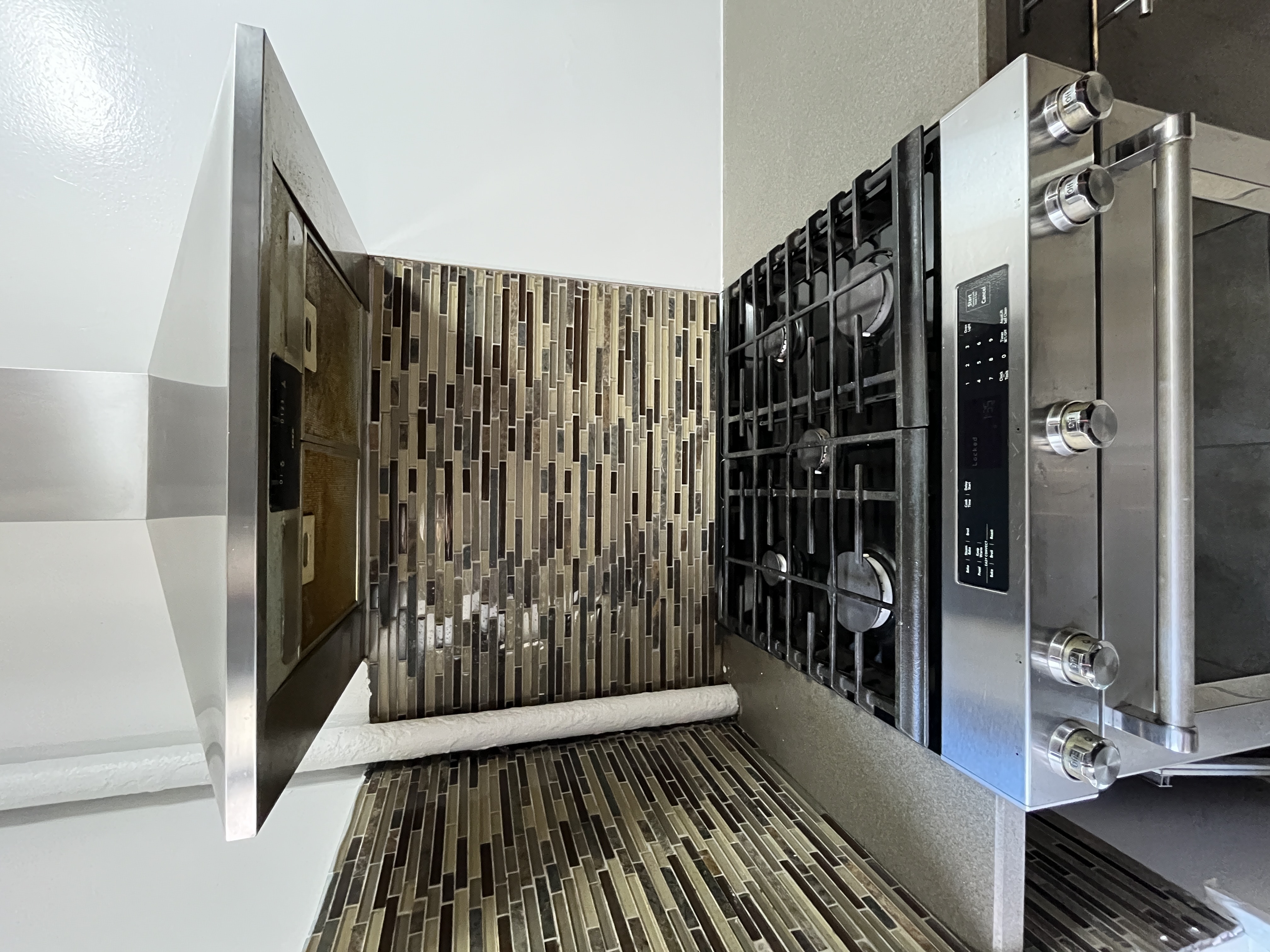 Undisclosed Address Manhattan, NY 10032 - Photo 5 of 9 a stove top oven sitting inside of a kitchen