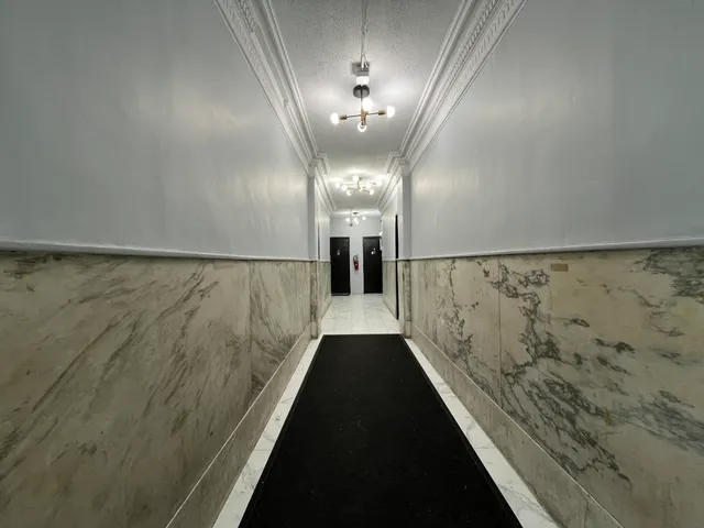 a view of a hallway with a window