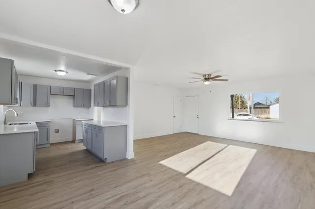 a view of kitchen with cabinets and wooden floor
