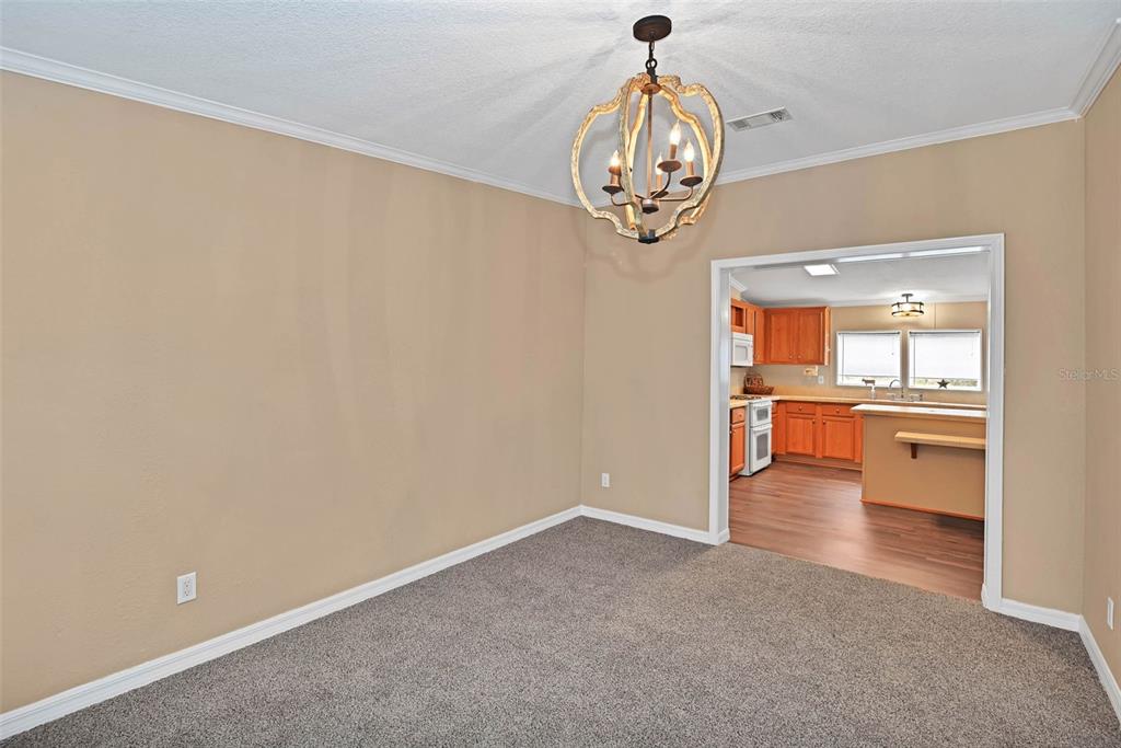 18546 Northeast 5th Terrace Road Citra, FL 32113 - Photo 18 of 30 a view of a room with a dining table and chairs
