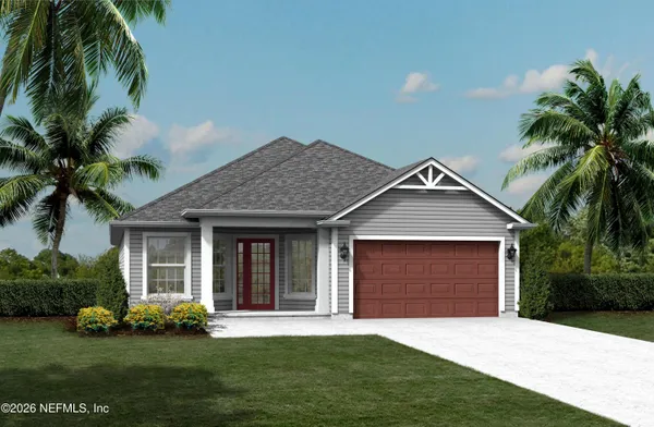 a front view of a house with a garden and yard