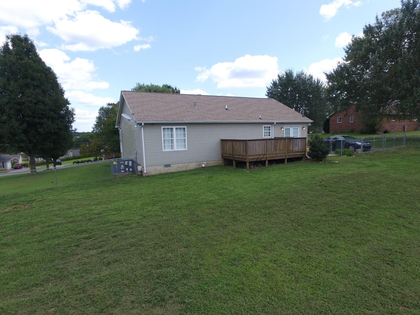 784 Blakemore Road Dickson, TN 37055 - Photo 3 of 11 a view of a house with a backyard