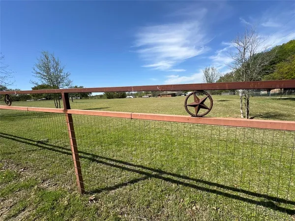 a view of swimming pool with a yard