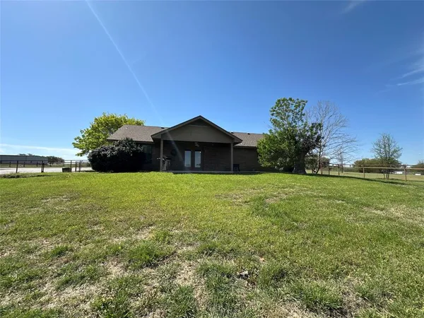 a front view of house with garden