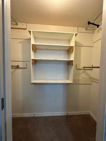 a view of an empty walk in closet