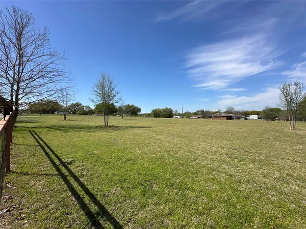 a view of a lake with a yard