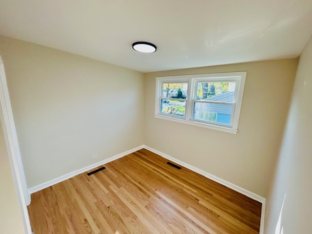768 North Rohde Avenue Hillside, IL 60162 - Photo 6 of 20 a view of a room with wooden floor and a window