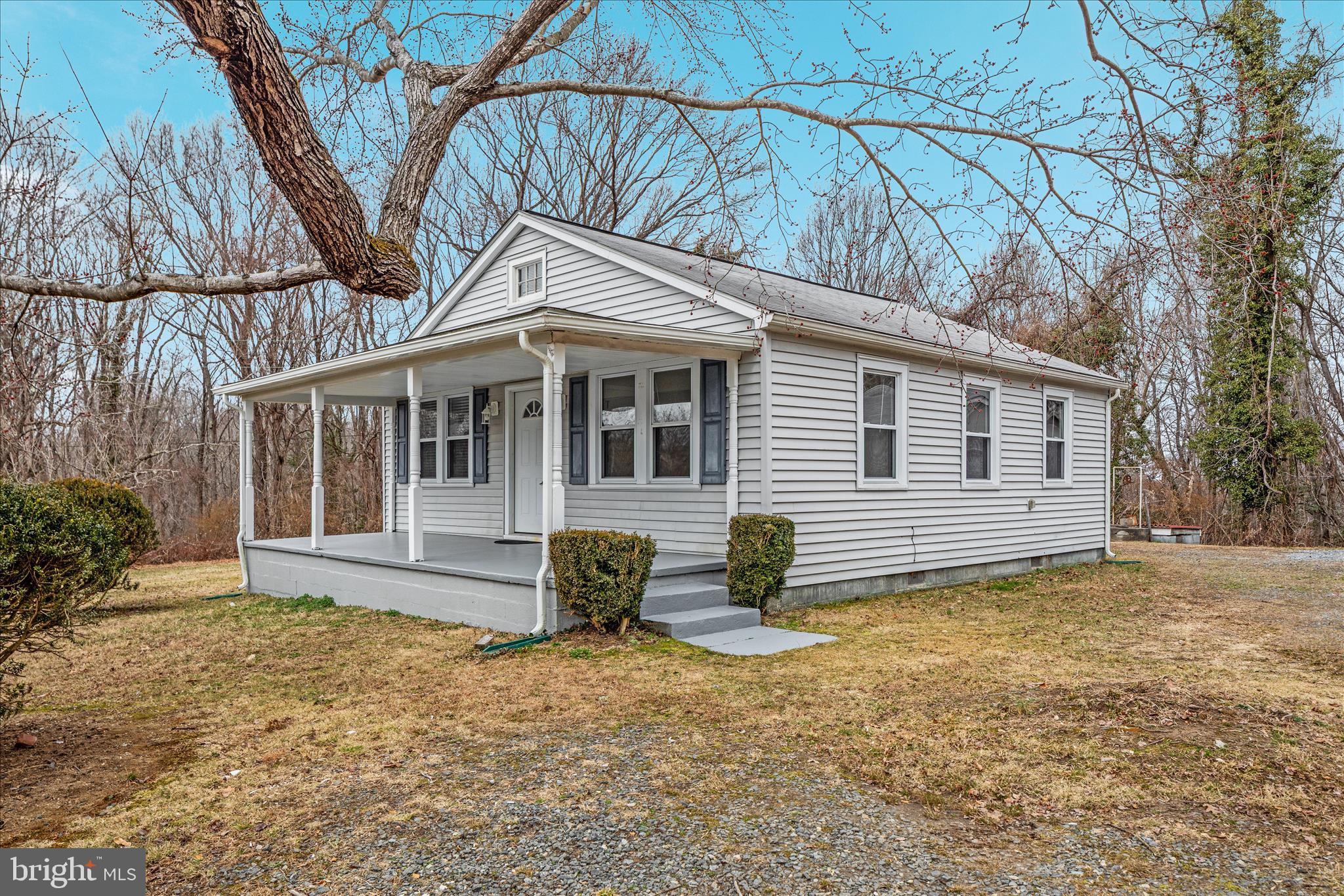 6533 Caledon Road King George, VA 22485 - Photo 2 of 32 a front view of a house with a yard