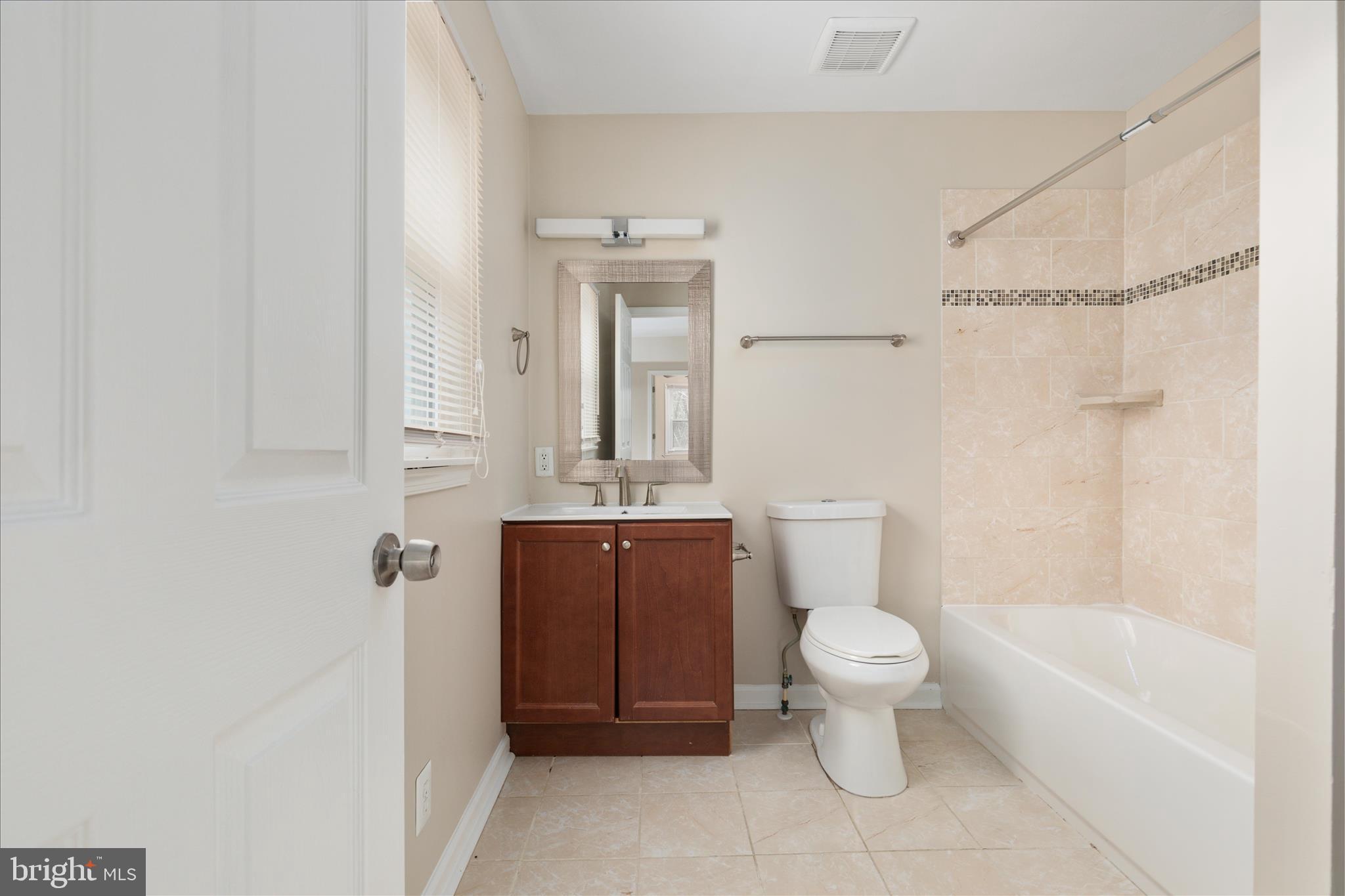 6533 Caledon Road King George, VA 22485 - Photo 21 of 32 a bathroom with a toilet sink and shower