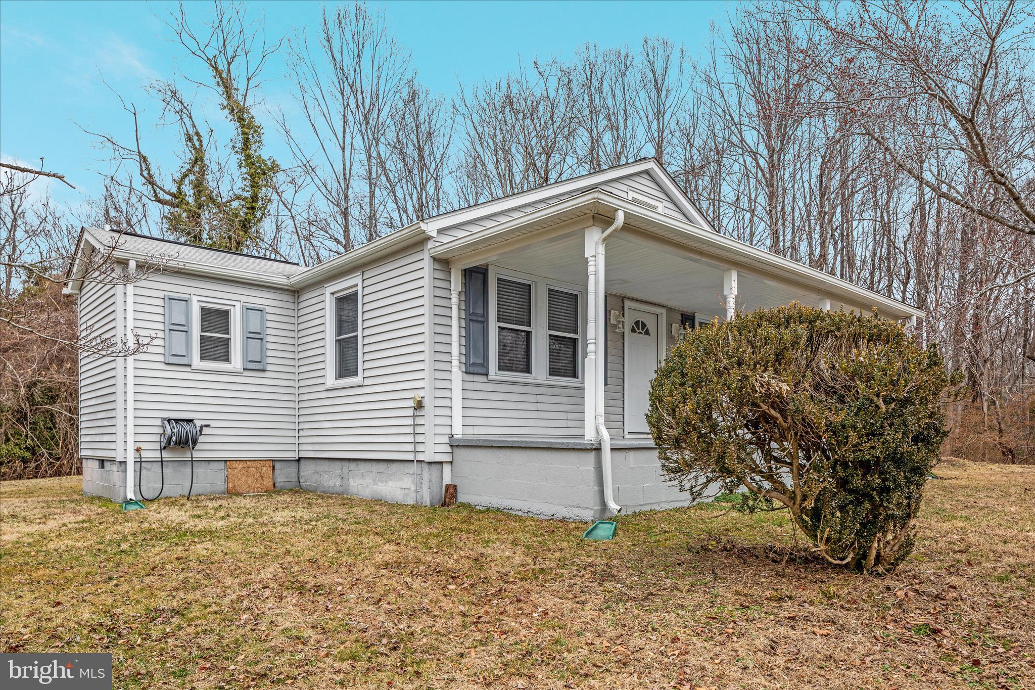6533 Caledon Road King George, VA 22485 - Photo 31 of 32 a house with trees in front of it